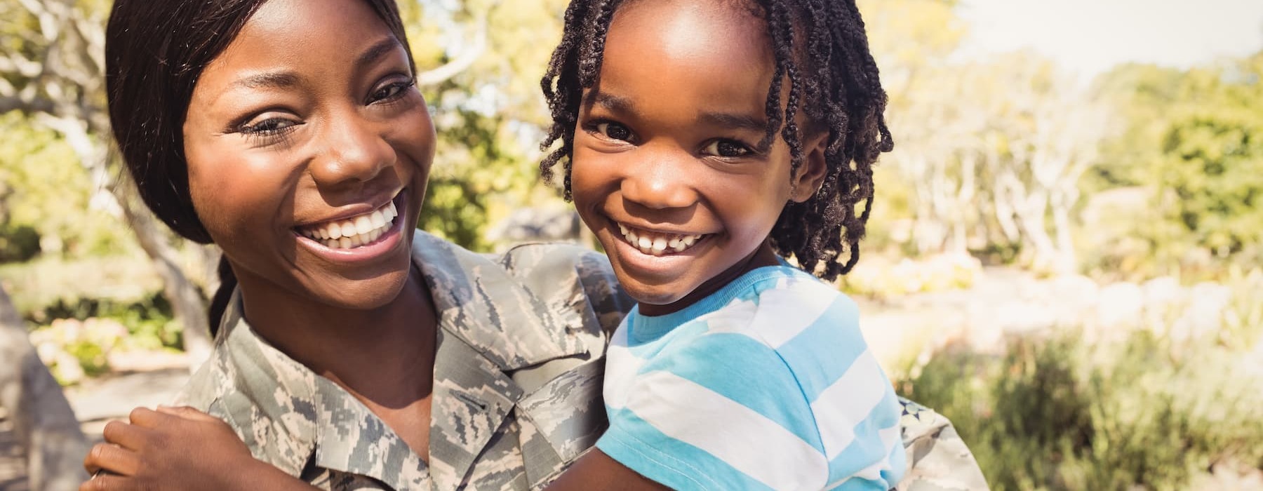 lifestyle image of a woman and a child outdoors